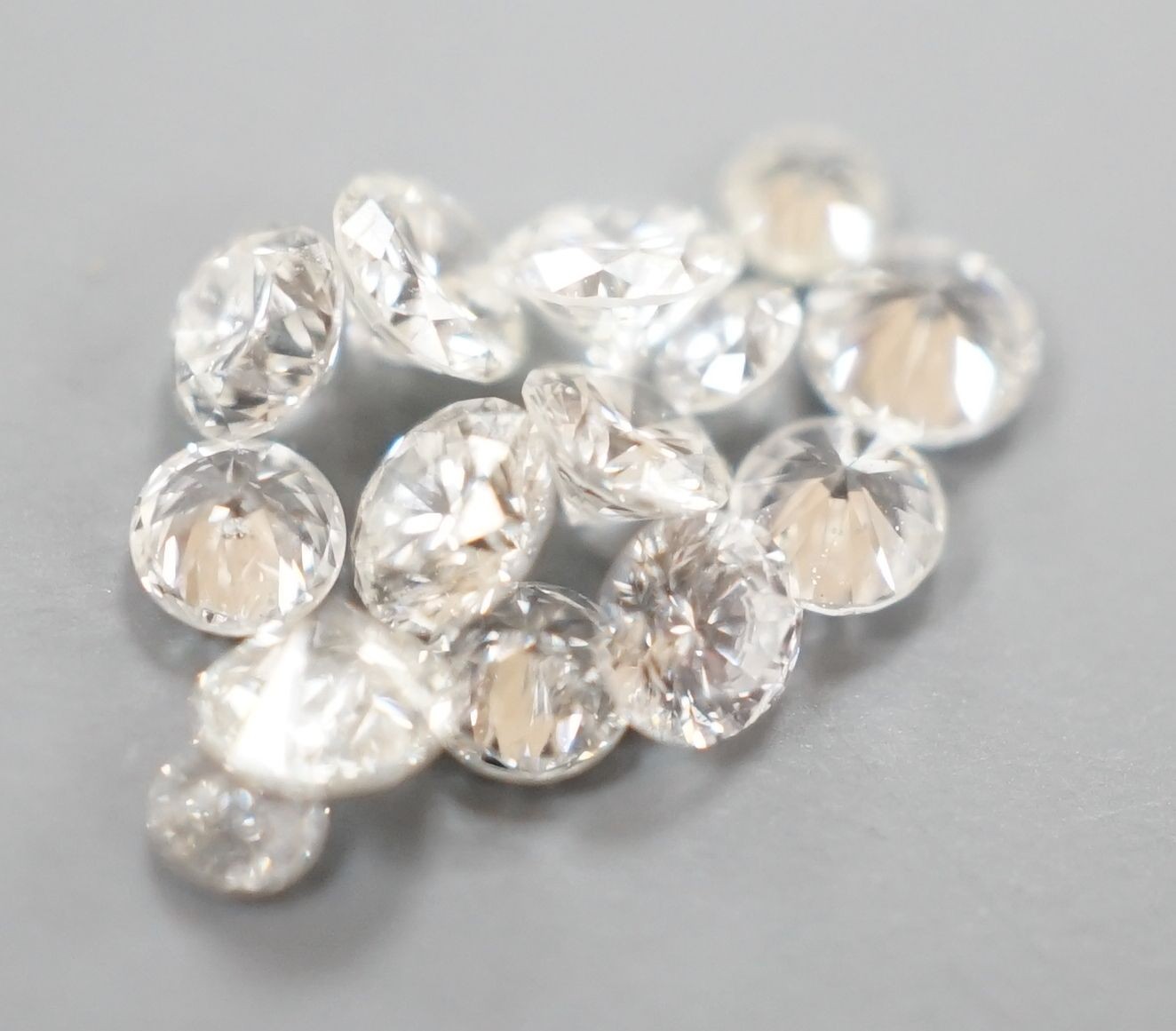 Fourteen small unmounted cut diamonds, total weight approx. 0.58ct.